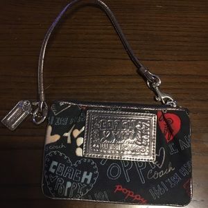 Small Coach Poppy line wristlet.